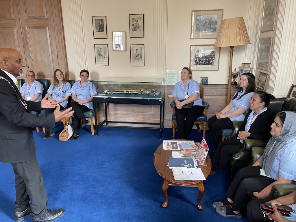 nurses and carers sitting in the mayor's office 